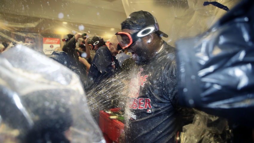 Boston Red Sox's David Ortiz celebrates with teammates after clinching the American League Eastern Division after a baseball game against the New York Yankees Wednesday, Sept. 28, 2016, in New York. (AP Photo/Frank Franklin II)